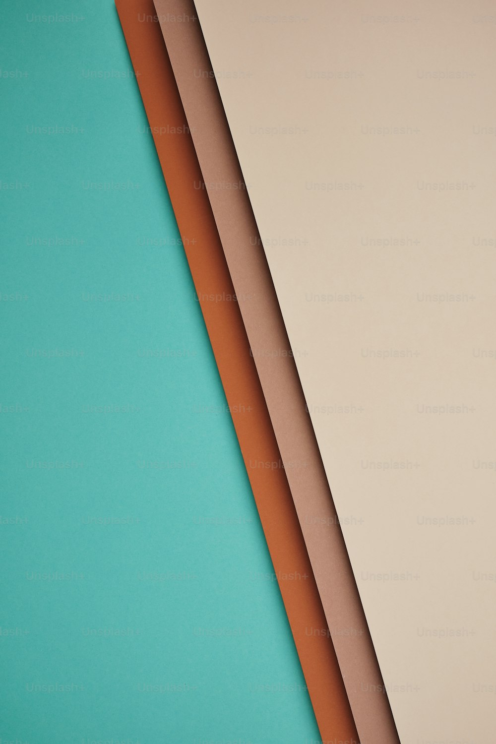 a close up of three different colored papers