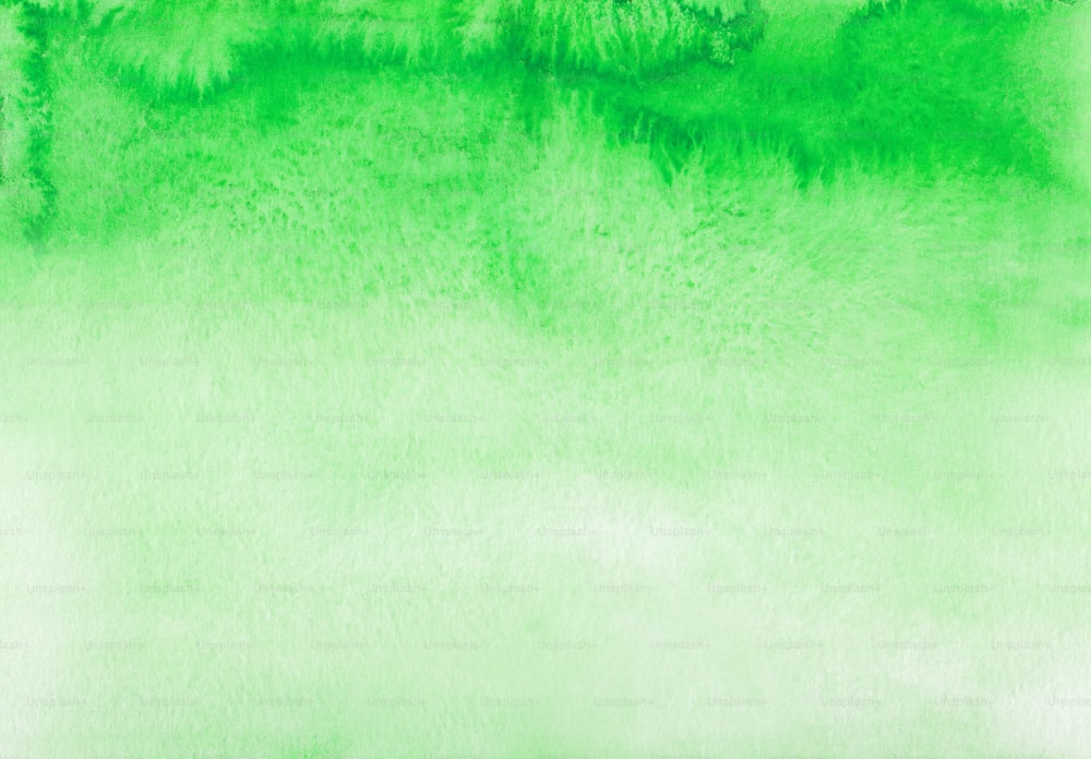 a green and white background with trees in the background