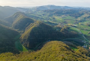 an aerial view of a valley and mountains