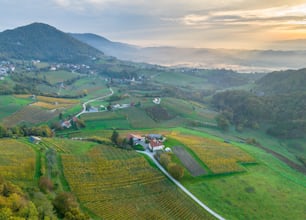 an aerial view of a small village in the middle of a valley