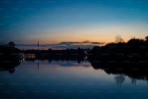 a body of water with a sky in the background