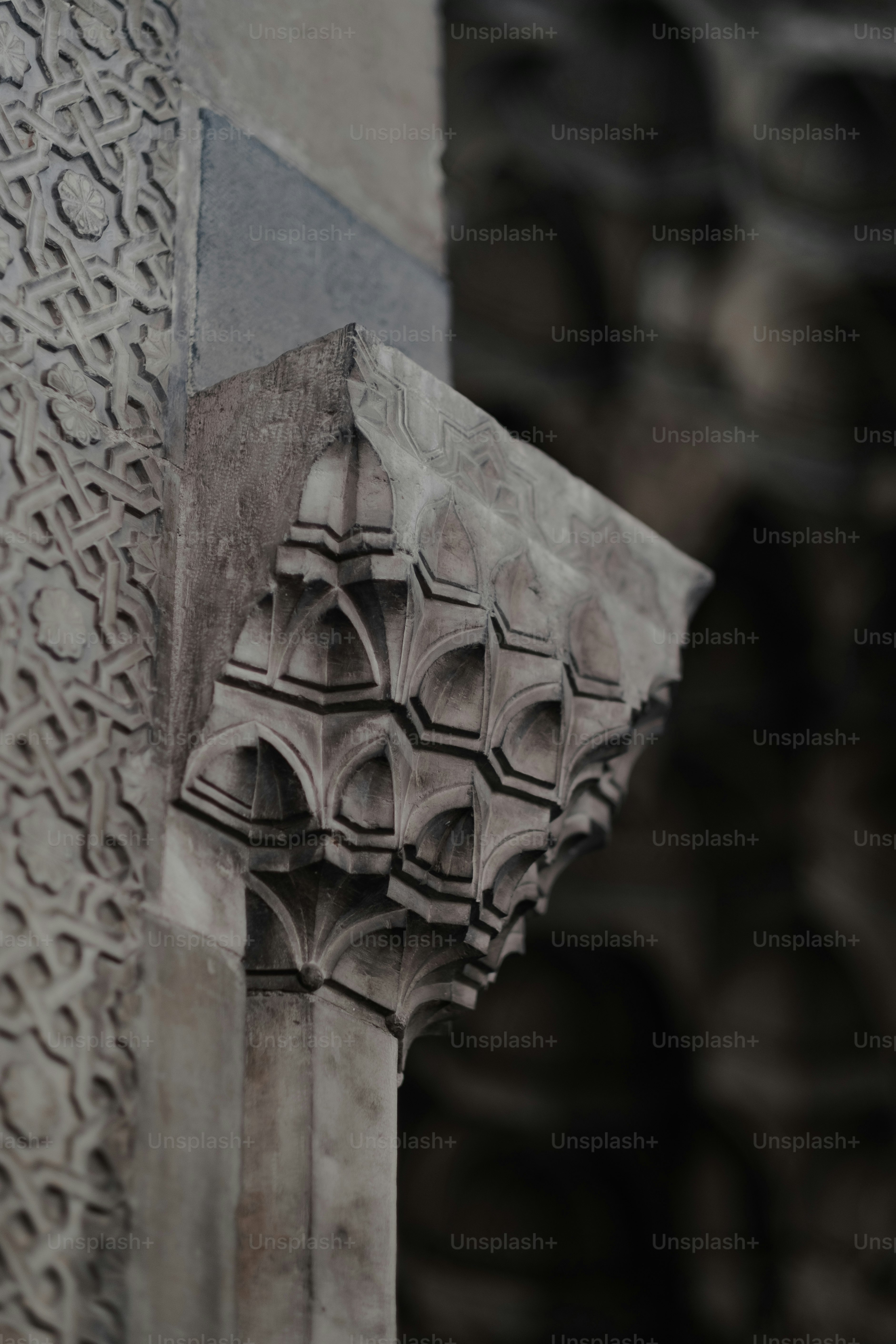 The corner of a building with a decorative design on it photo – Mosque ...