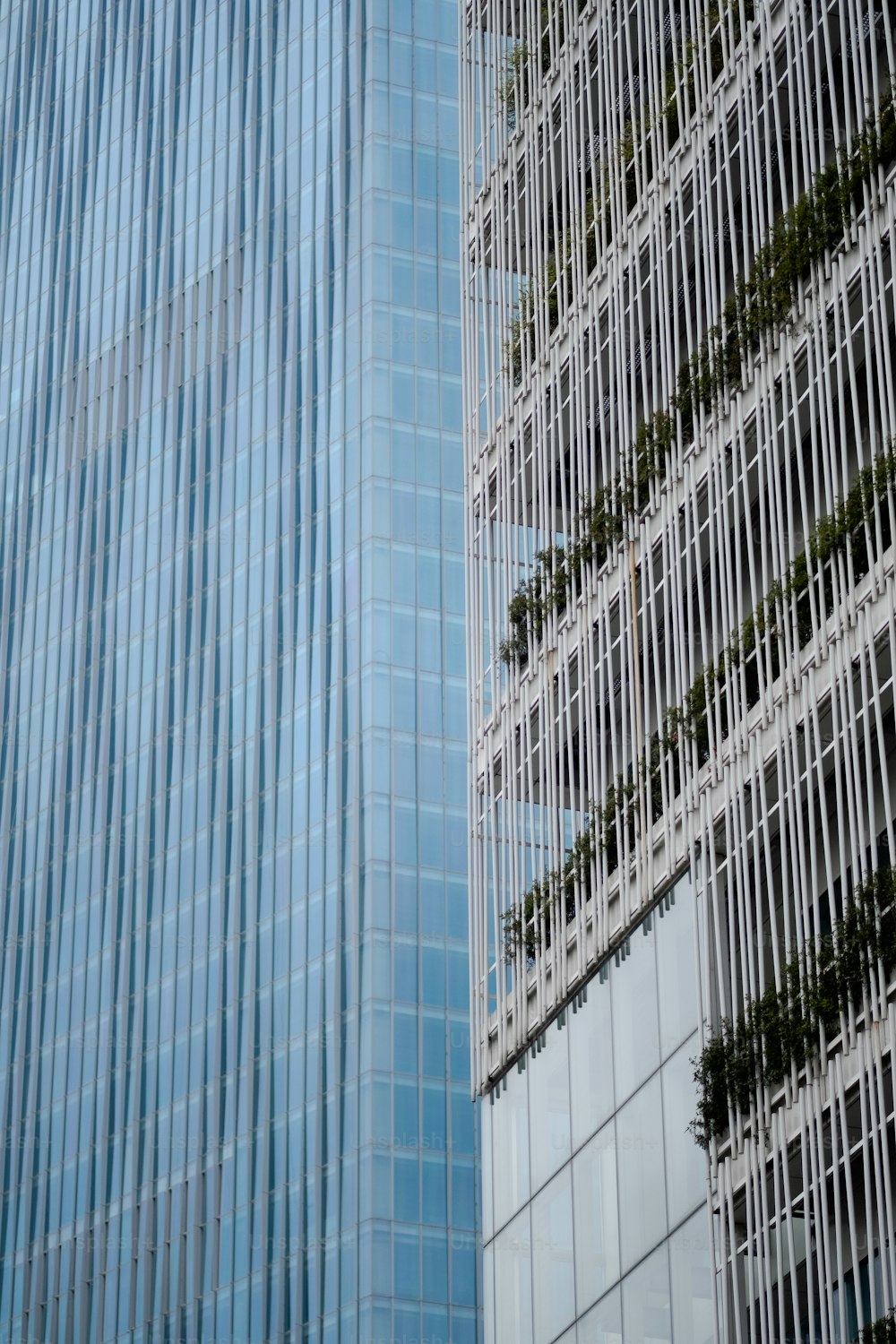 a tall building with a bunch of windows next to it