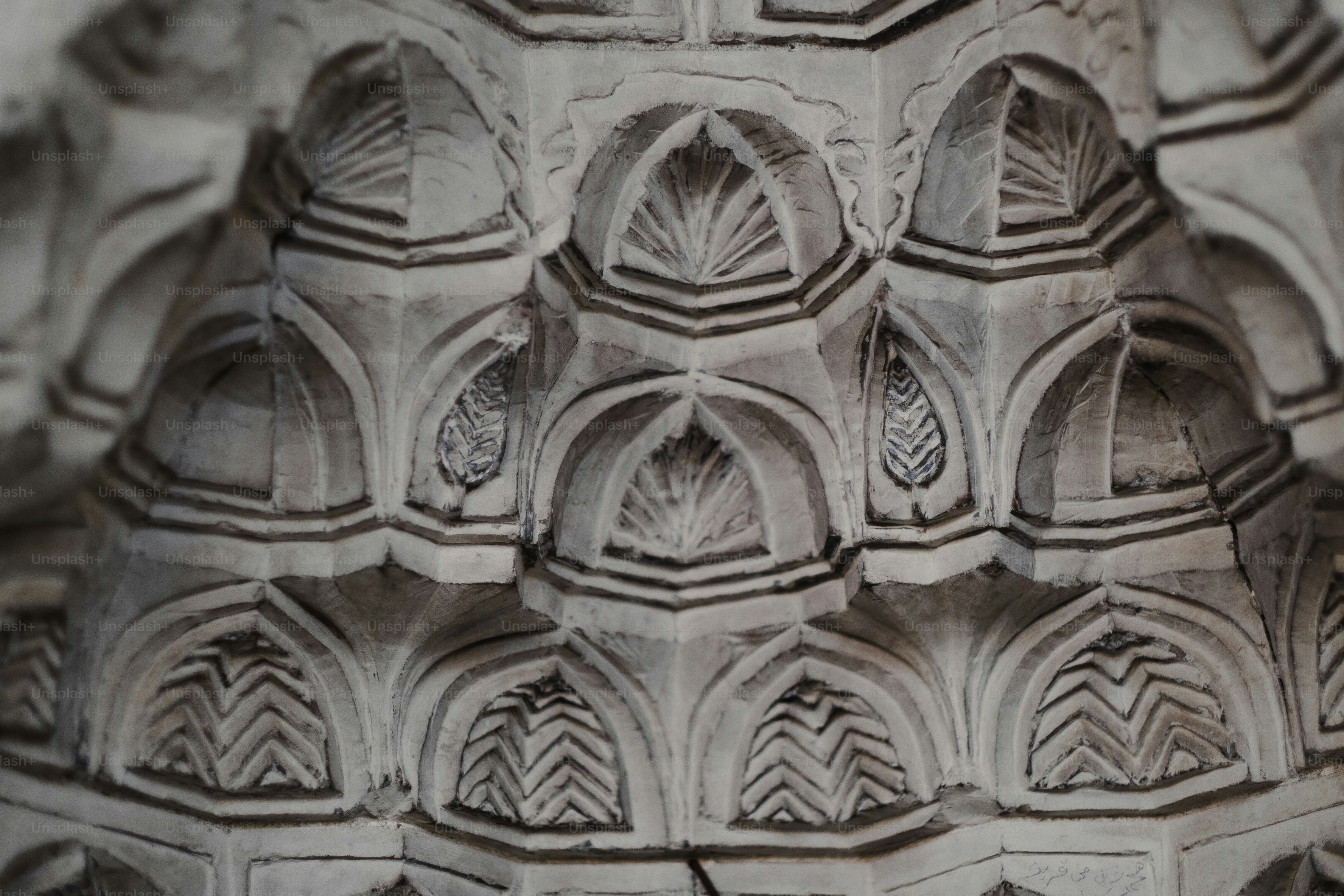 A close up of a building made of stone photo – Outdoors Image on Unsplash