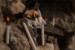 a bunch of candles that are on some rocks