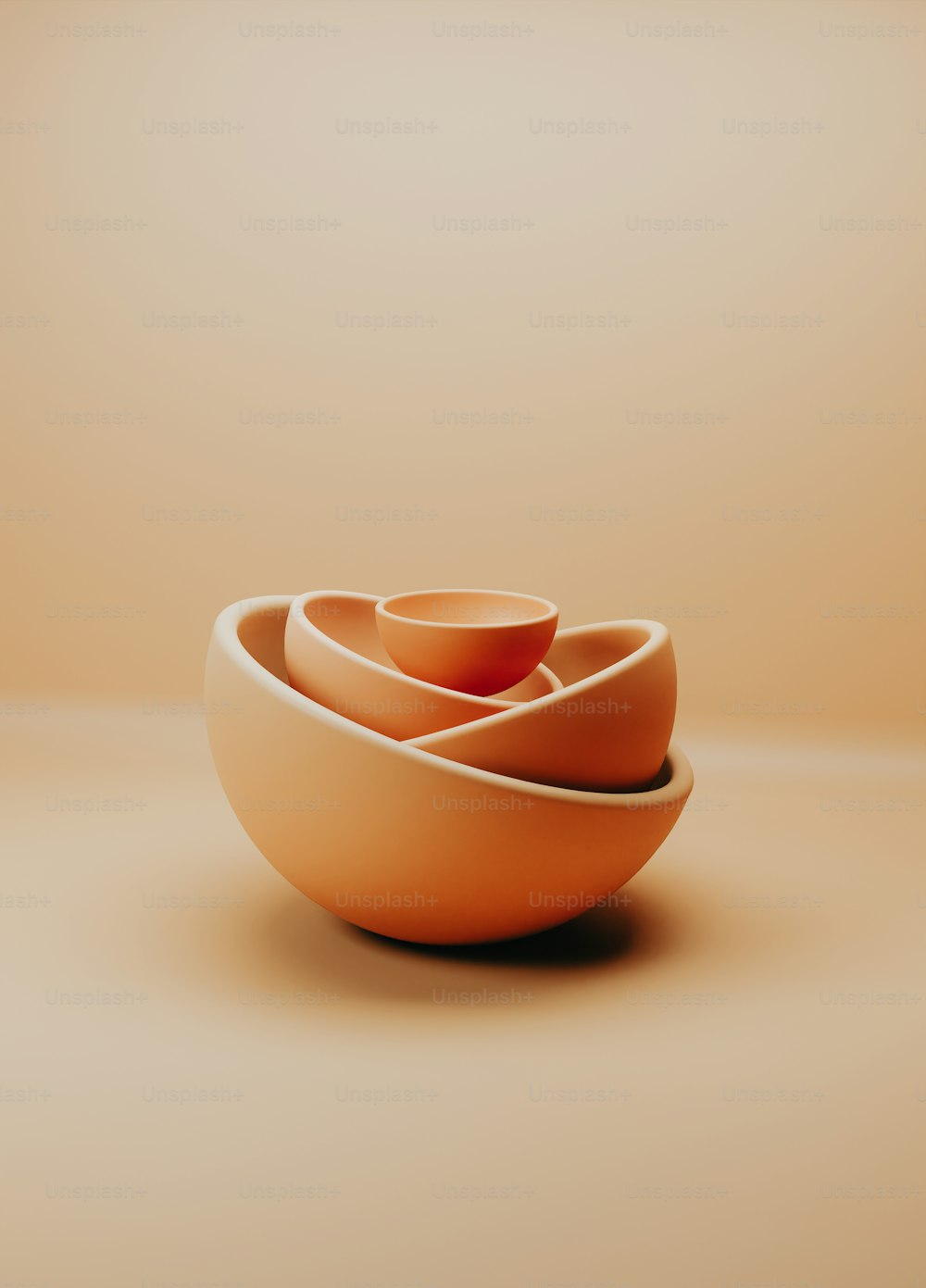 three orange bowls stacked on top of each other