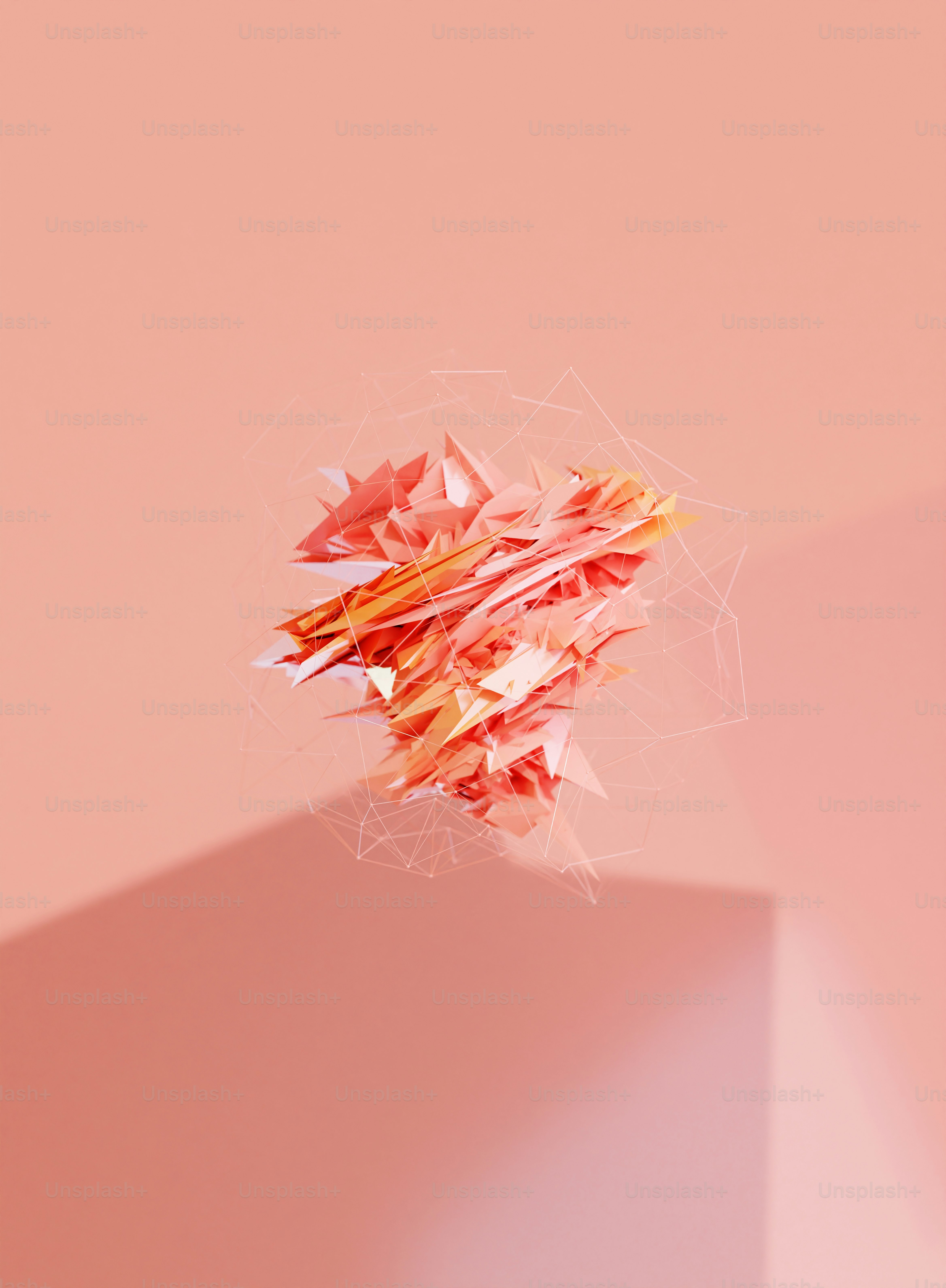 uma pilha de papel sentada em cima de uma parede rosa