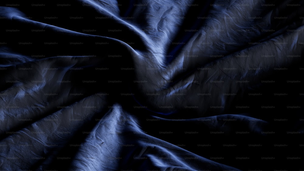 un fond noir avec une texture de tissu bleu