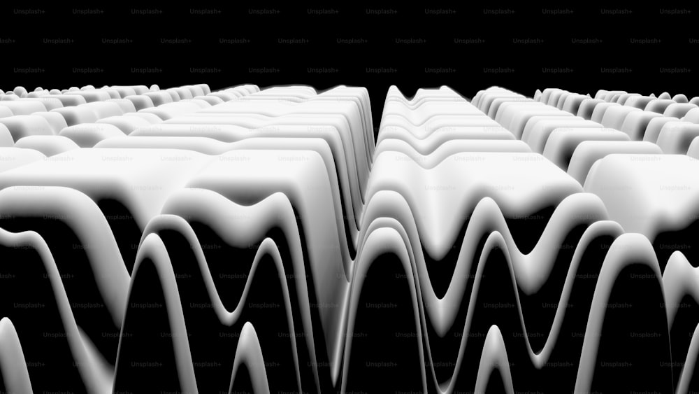 a black and white photo of a group of wavy lines