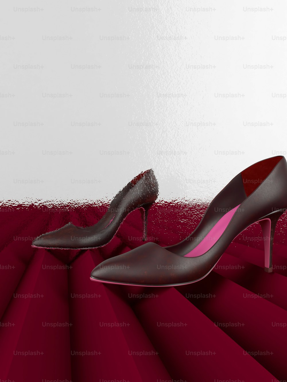 a pair of high heeled shoes on a red and white background
