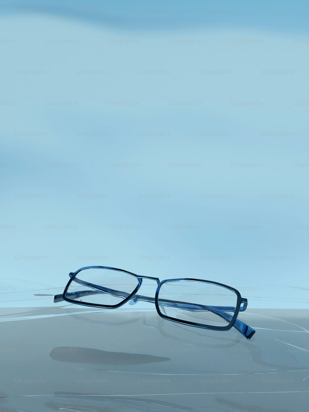 a pair of glasses sitting on top of a table