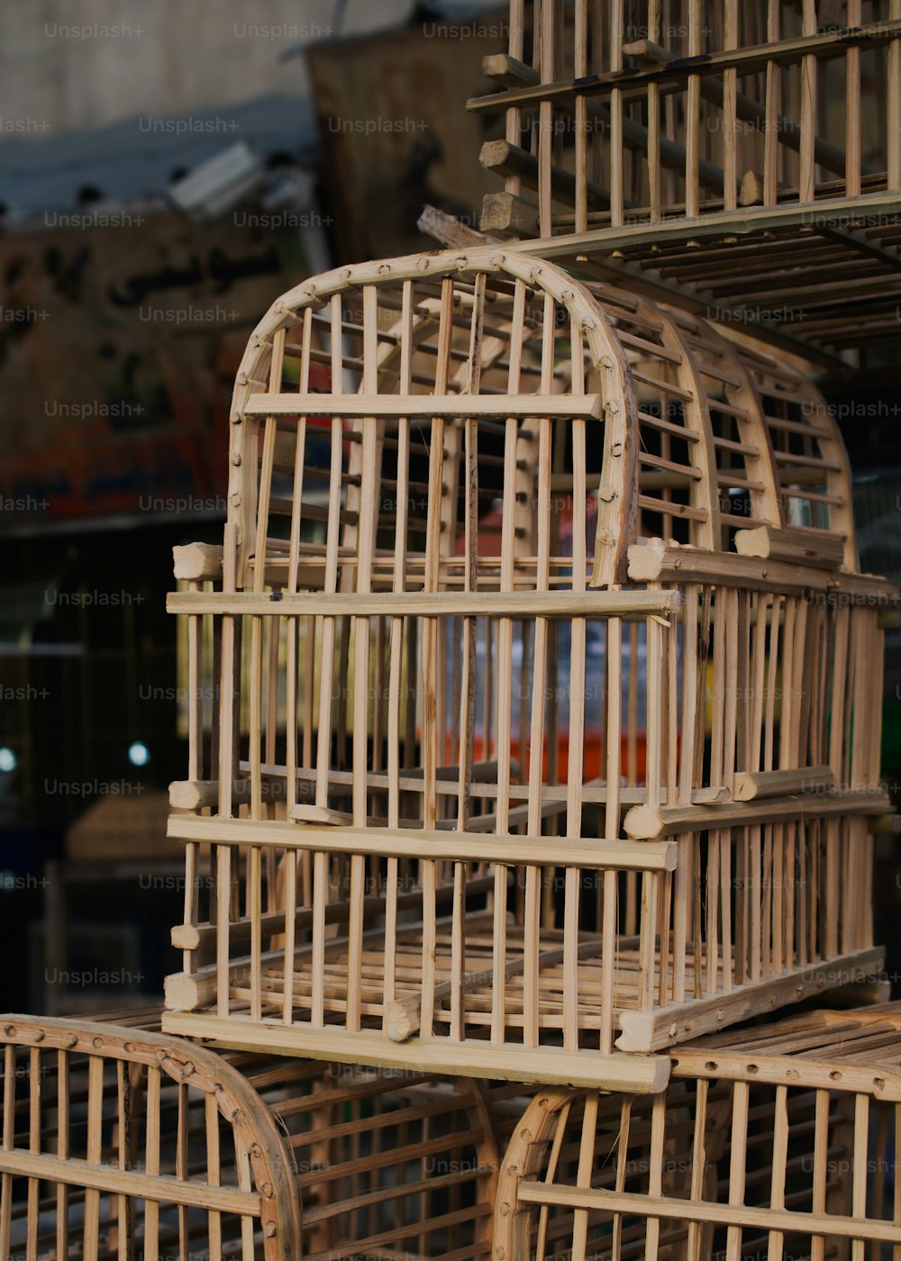 a bunch of wooden cages stacked on top of each other
