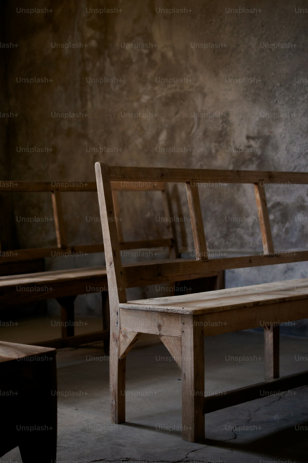 a couple of wooden benches sitting next to each other