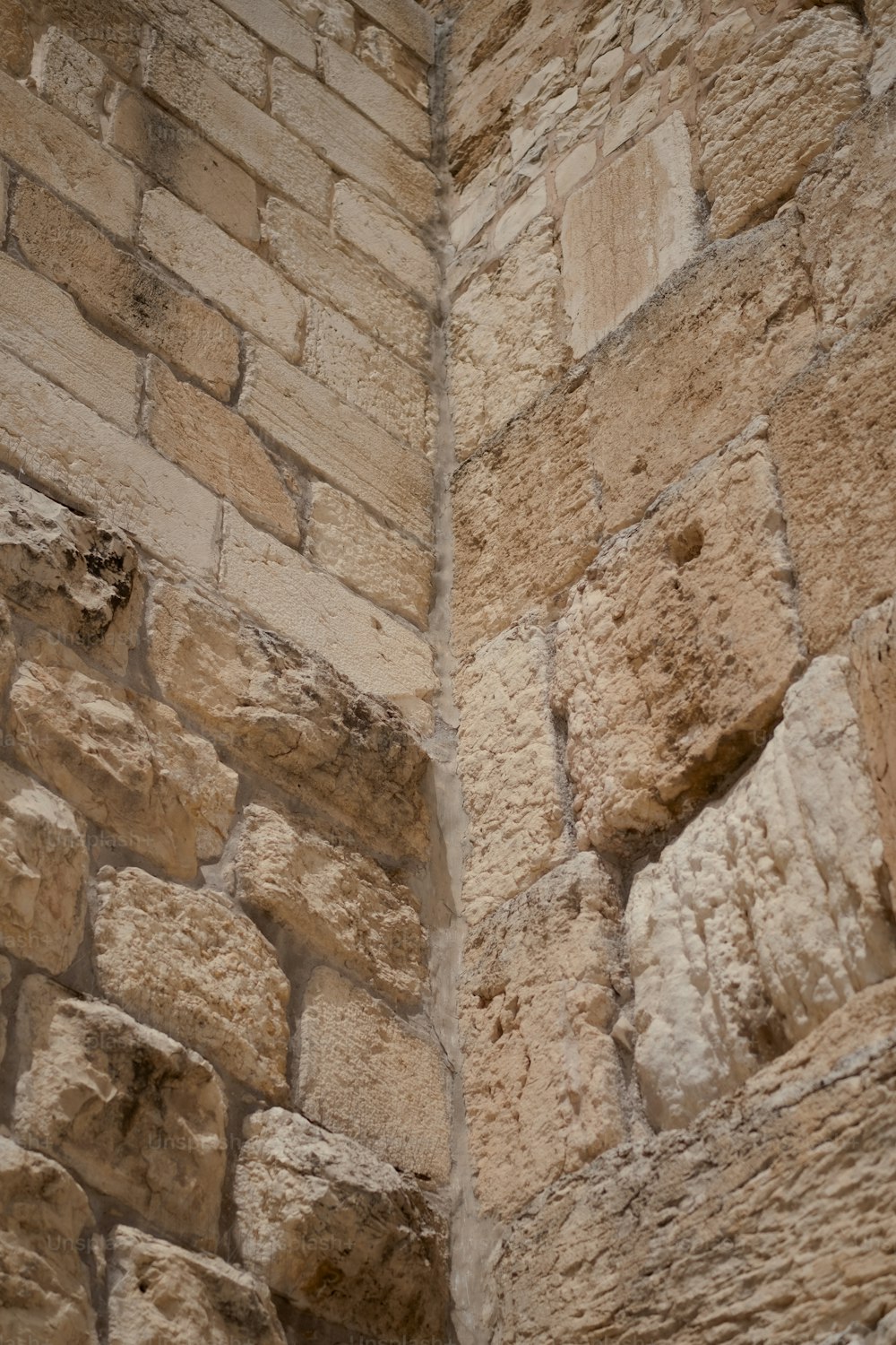 a clock on the side of a stone building