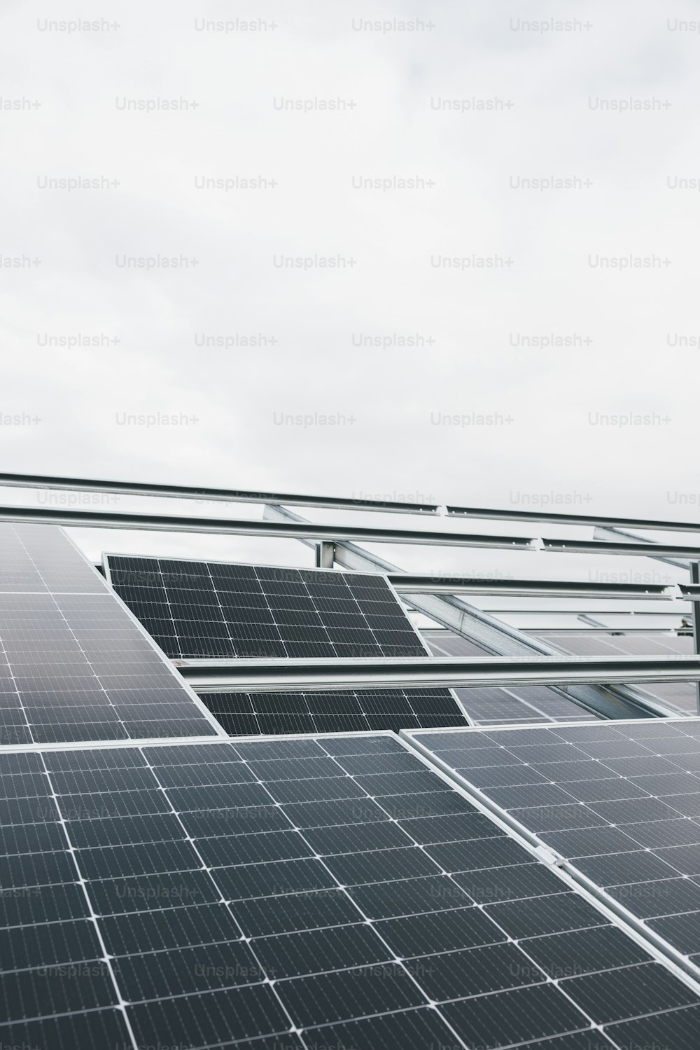 a row of solar panels sitting on top of a roof