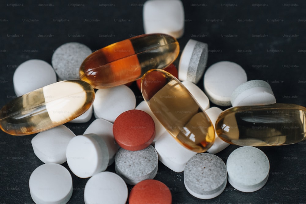 a pile of pills sitting on top of a table