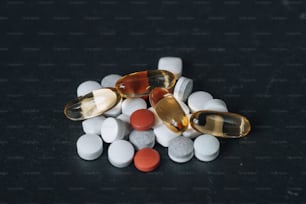 a pile of pills sitting on top of a table
