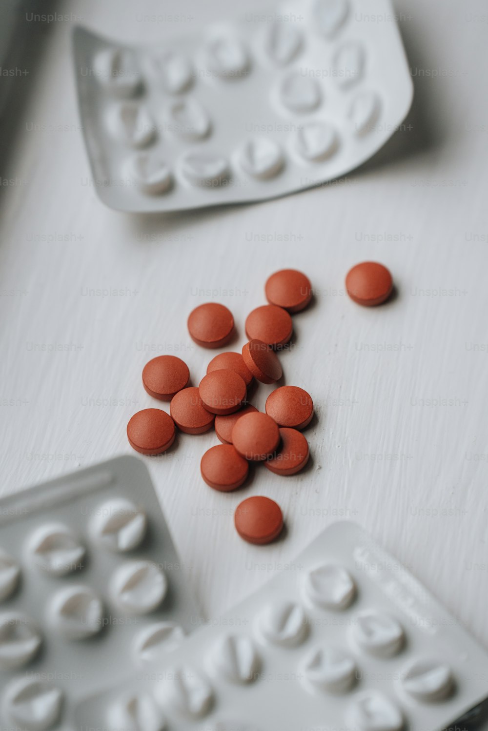 a close up of a bunch of pills on a table