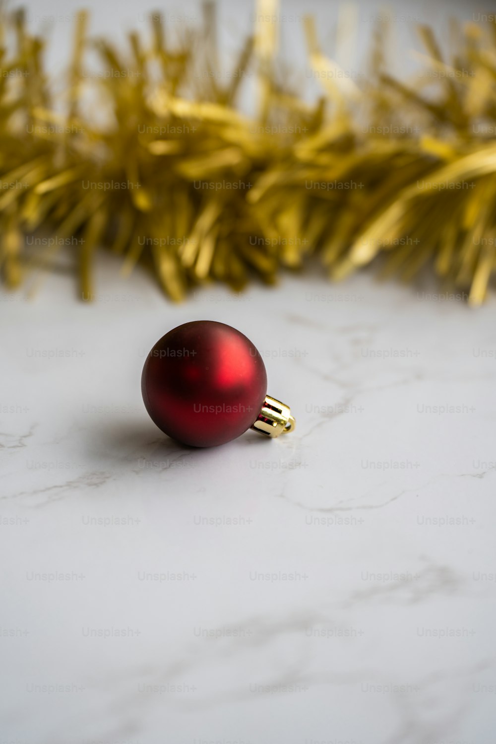 a red ornament sitting on top of a white counter