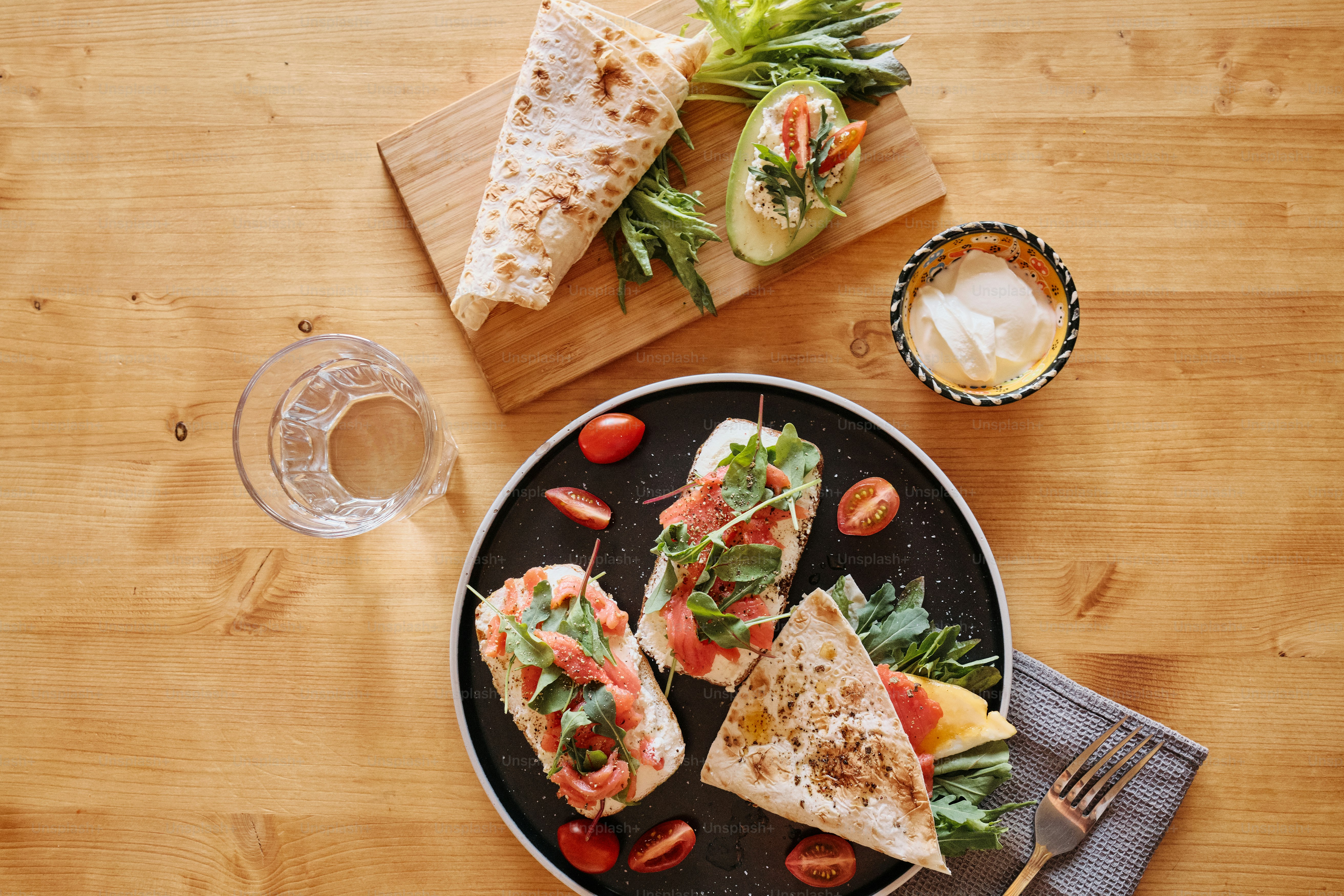 a plate of food on a wooden table