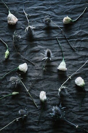 a bunch of flowers that are laying on a table