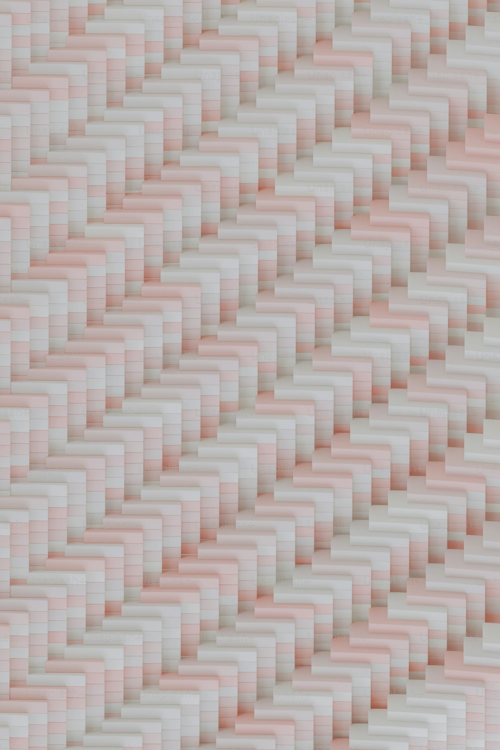 Una pared rosa y blanca con un patrón de cuadrados