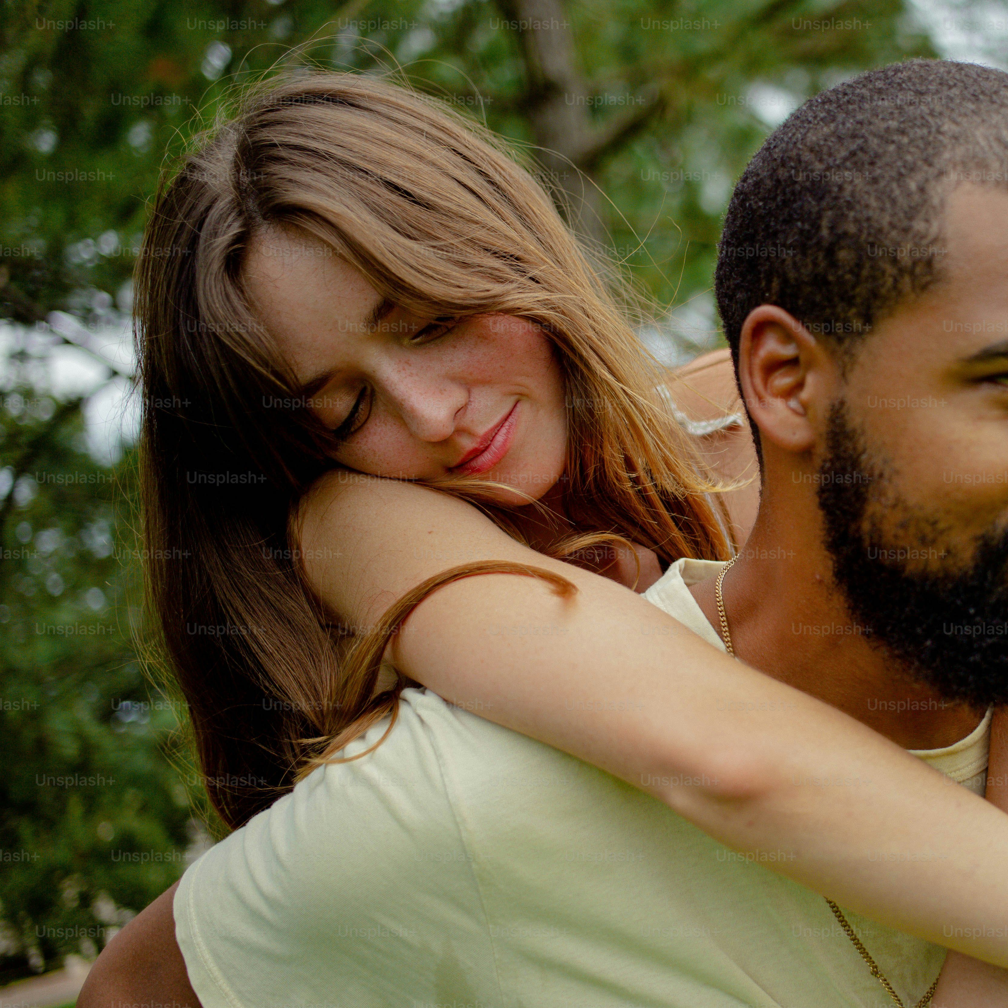 a man holding a woman in his arms