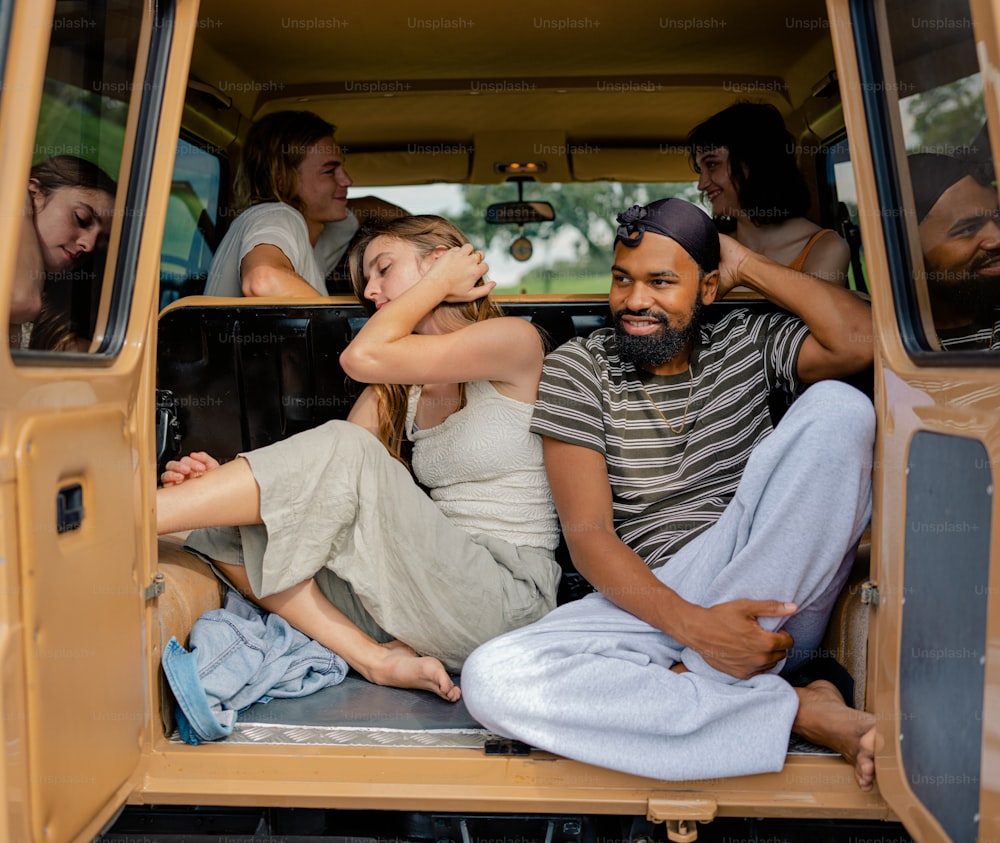 a group of people sitting in the back of a truck