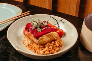 a white plate topped with rice and meat