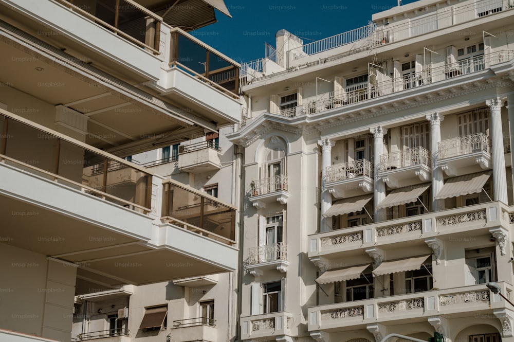 a large white building with balconies and balconies