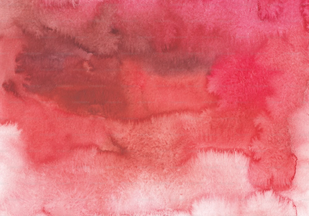 a watercolor painting of a red and pink background