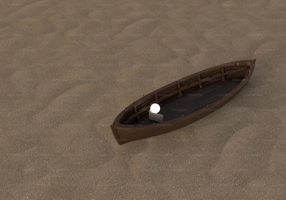 Un petit bateau assis au sommet d’une plage de sable