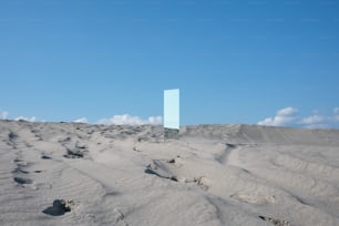 a blue square in the middle of a desert