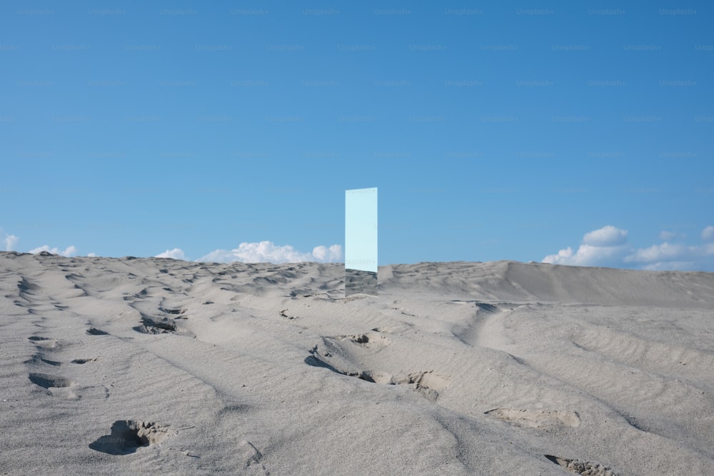 a blue square in the middle of a desert