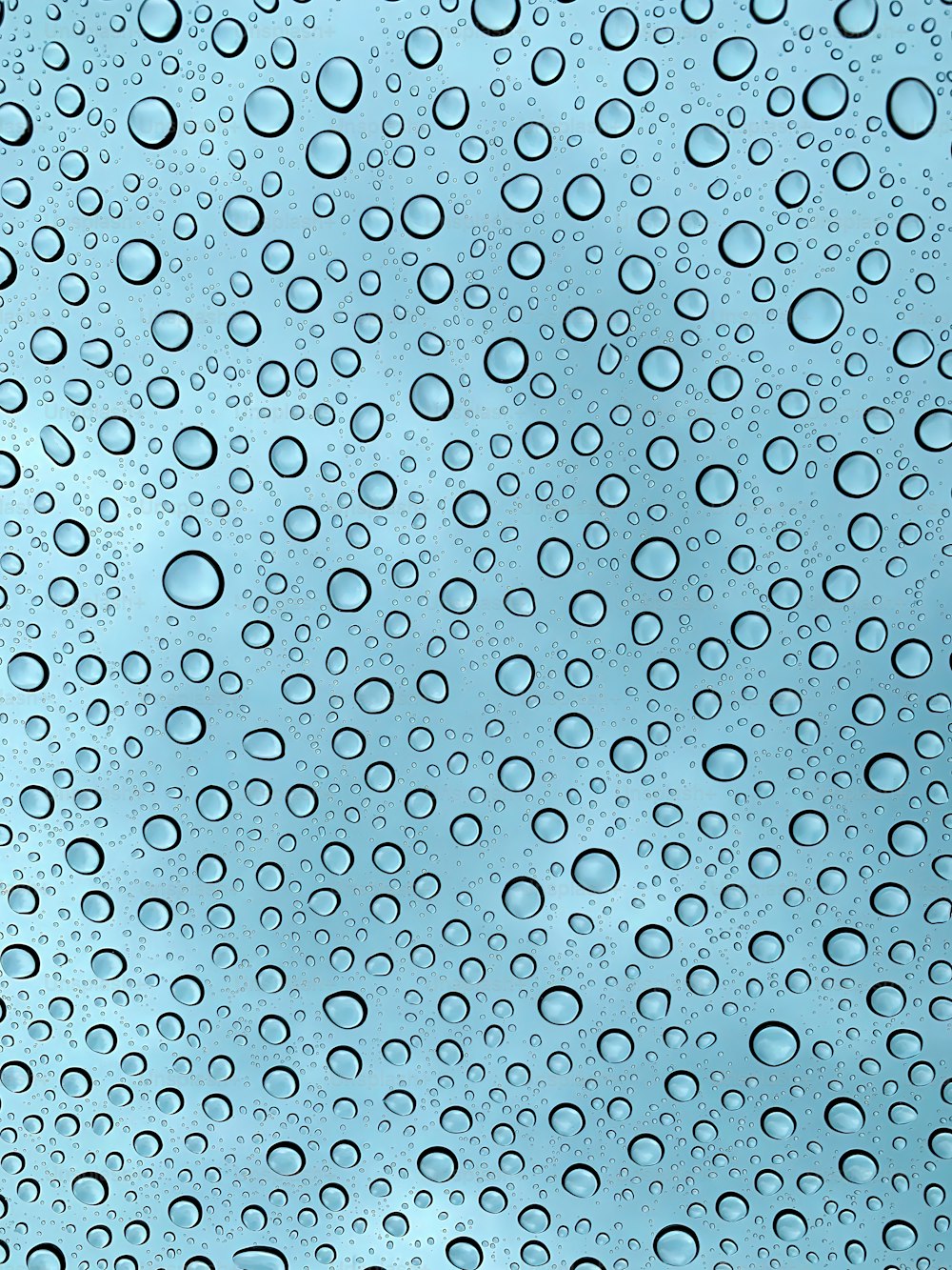 a close up of water droplets on a window