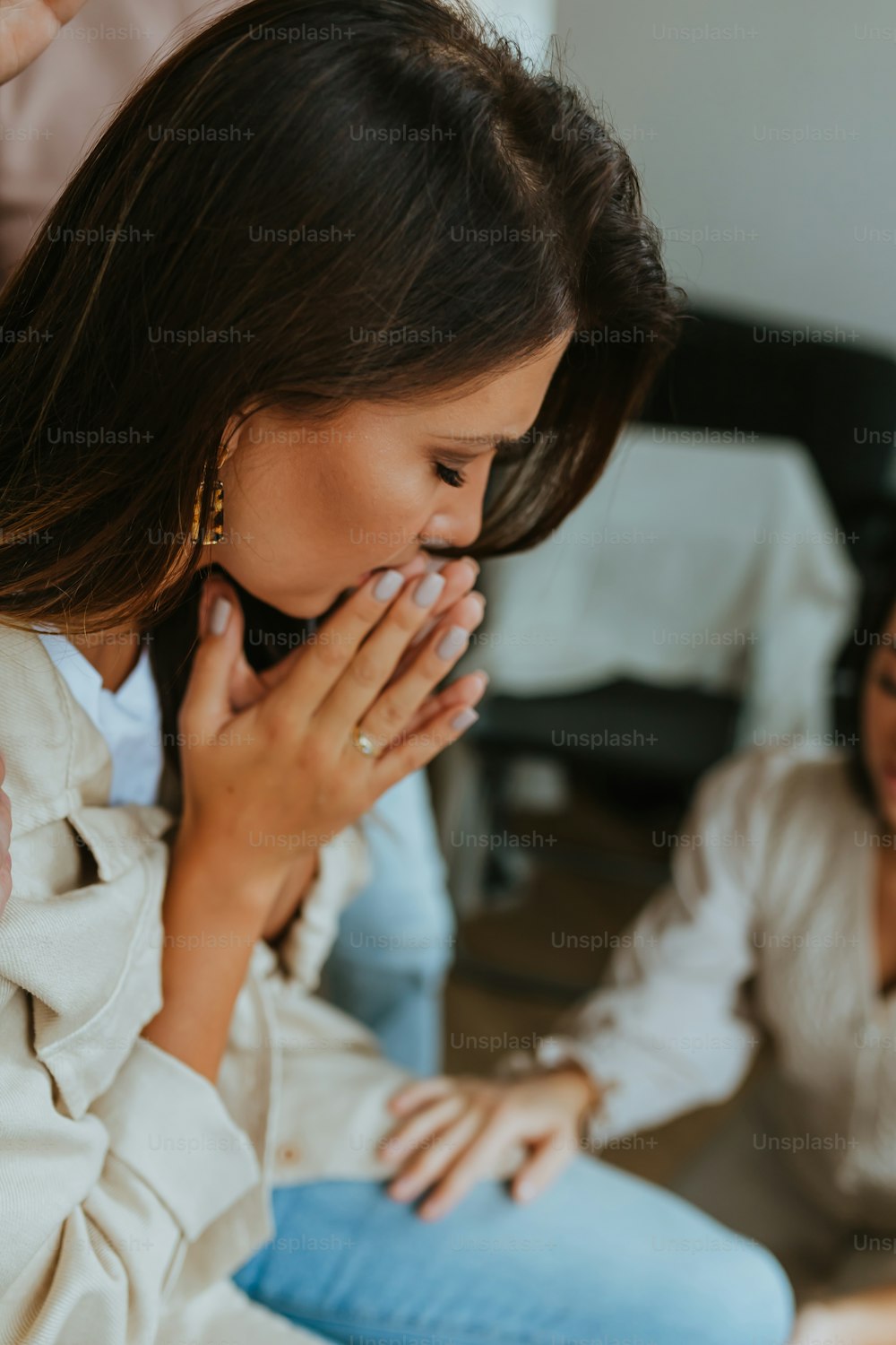 a woman holding her face