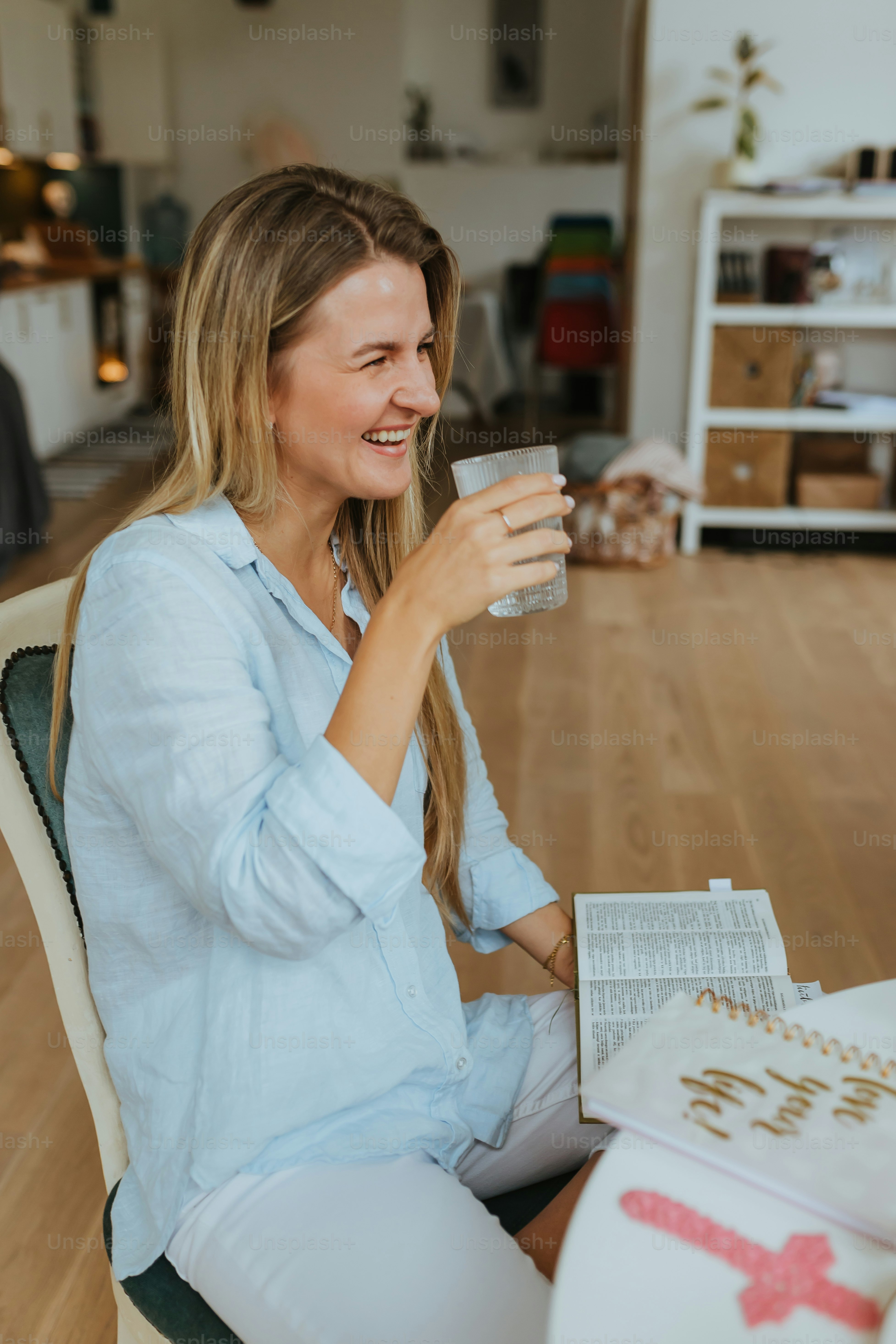 a woman sitting on a couch and smiling