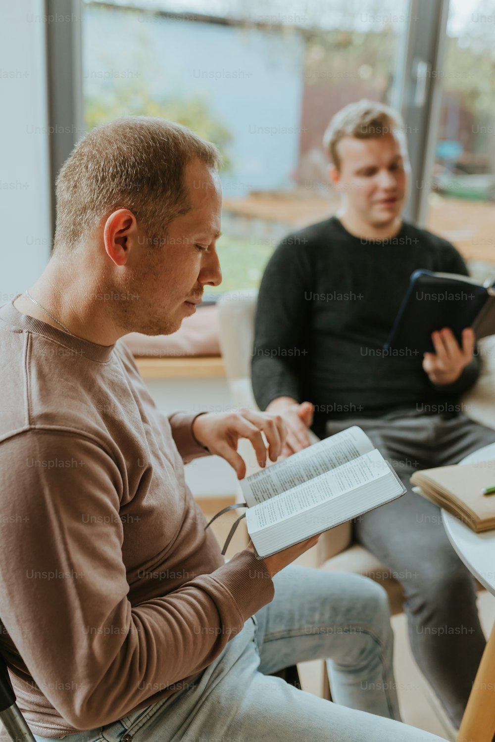 a man and a woman sitting in a classroom