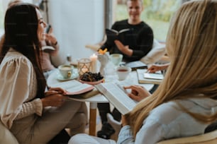 a group of people sitting around a table