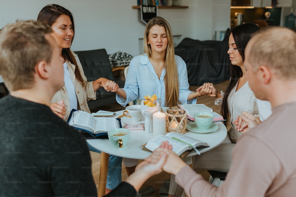 a group of people sitting around a table