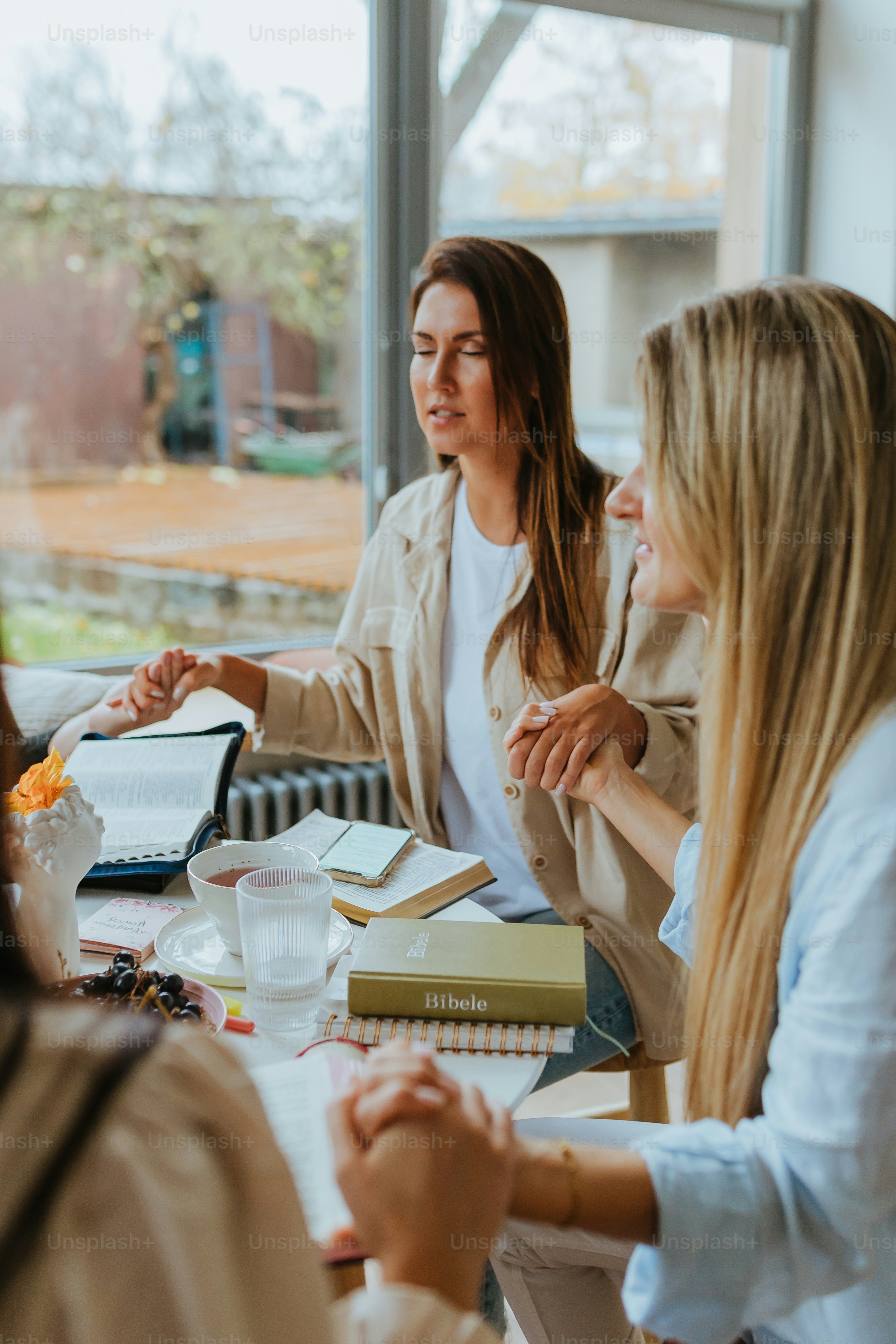 a few women sitting at a table