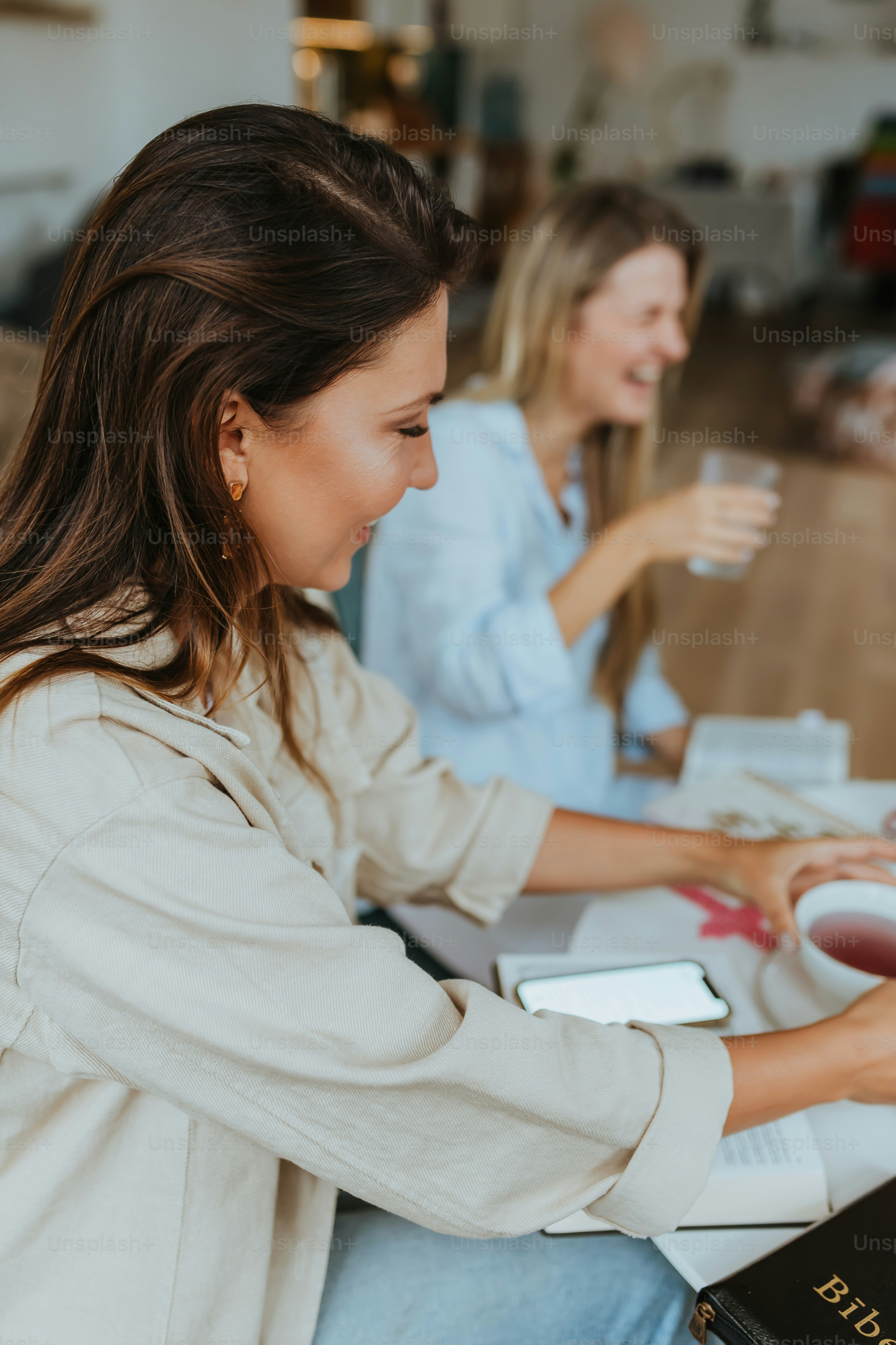 a woman holding a cup