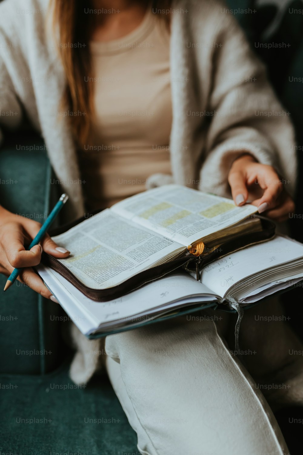 a person writing on a book