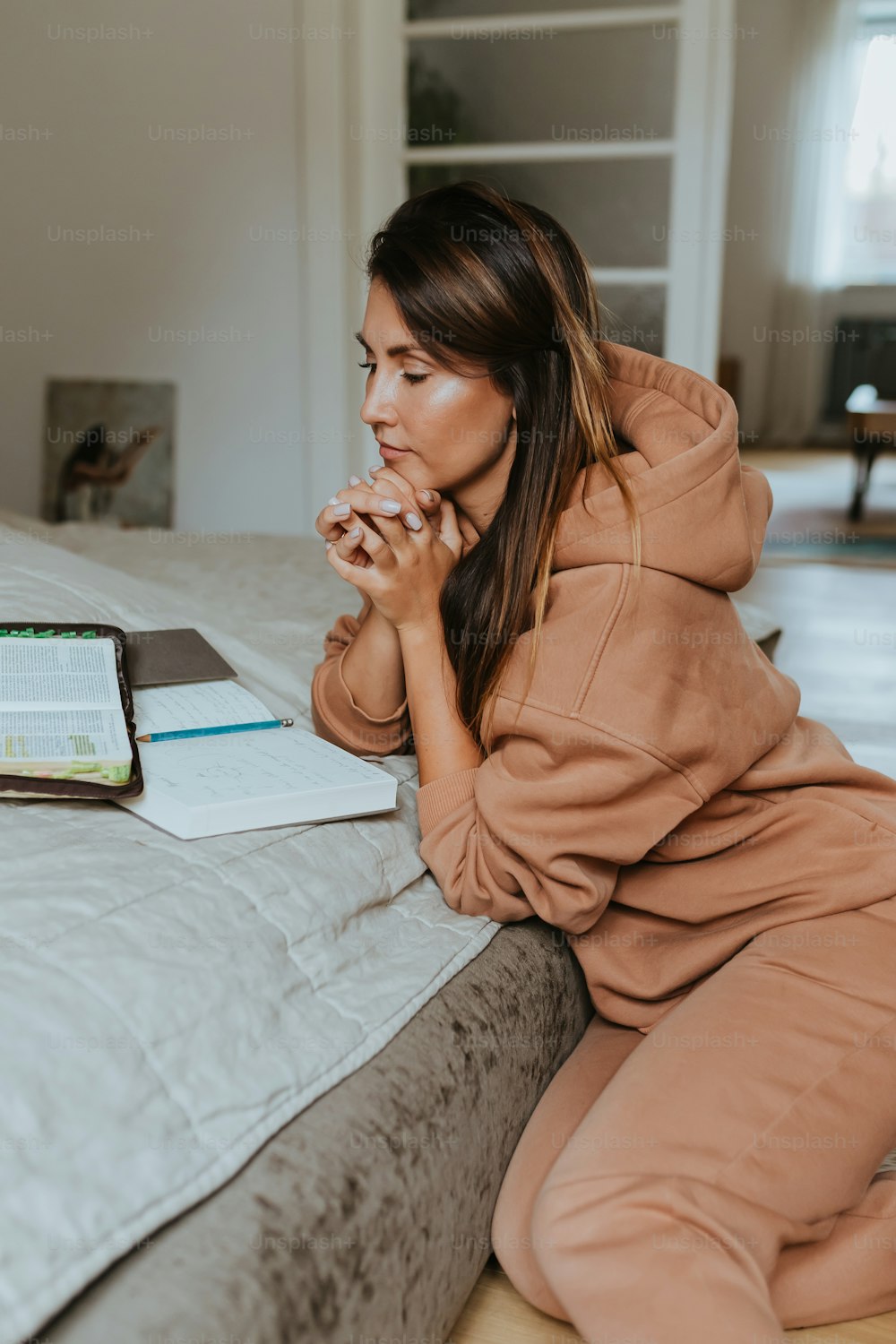 a woman sitting on a bed