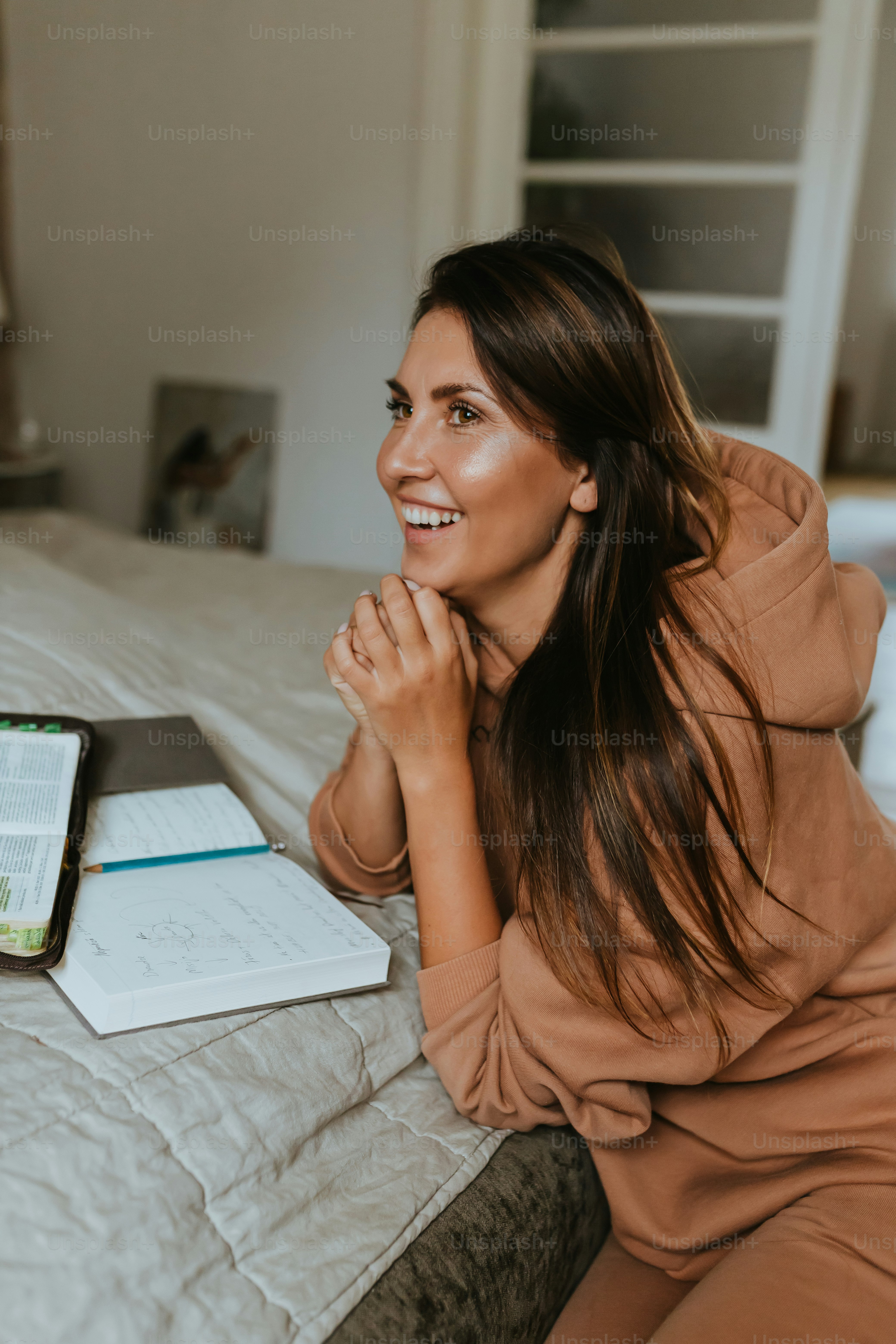 a woman sitting on a bed