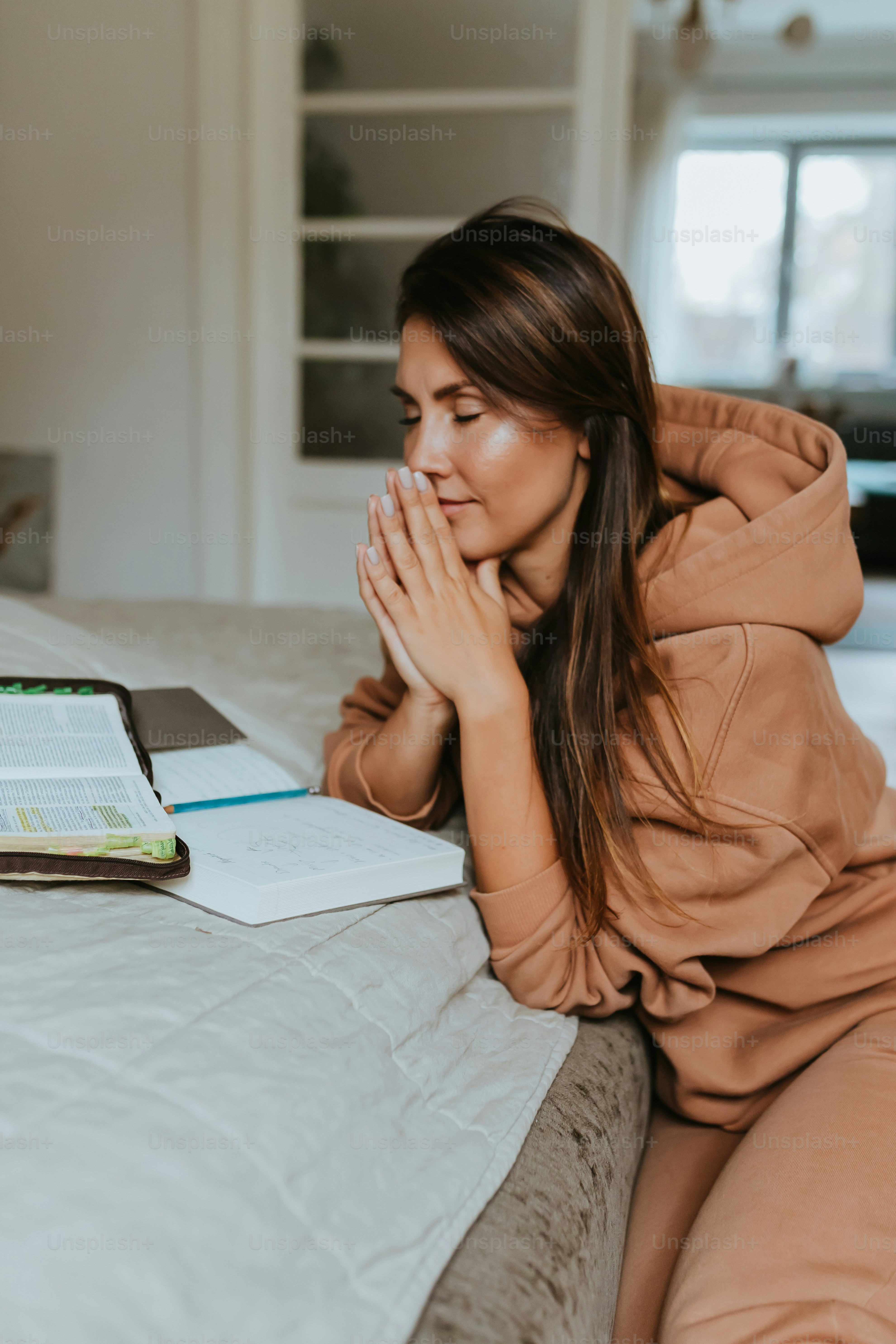 a woman sitting on a bed