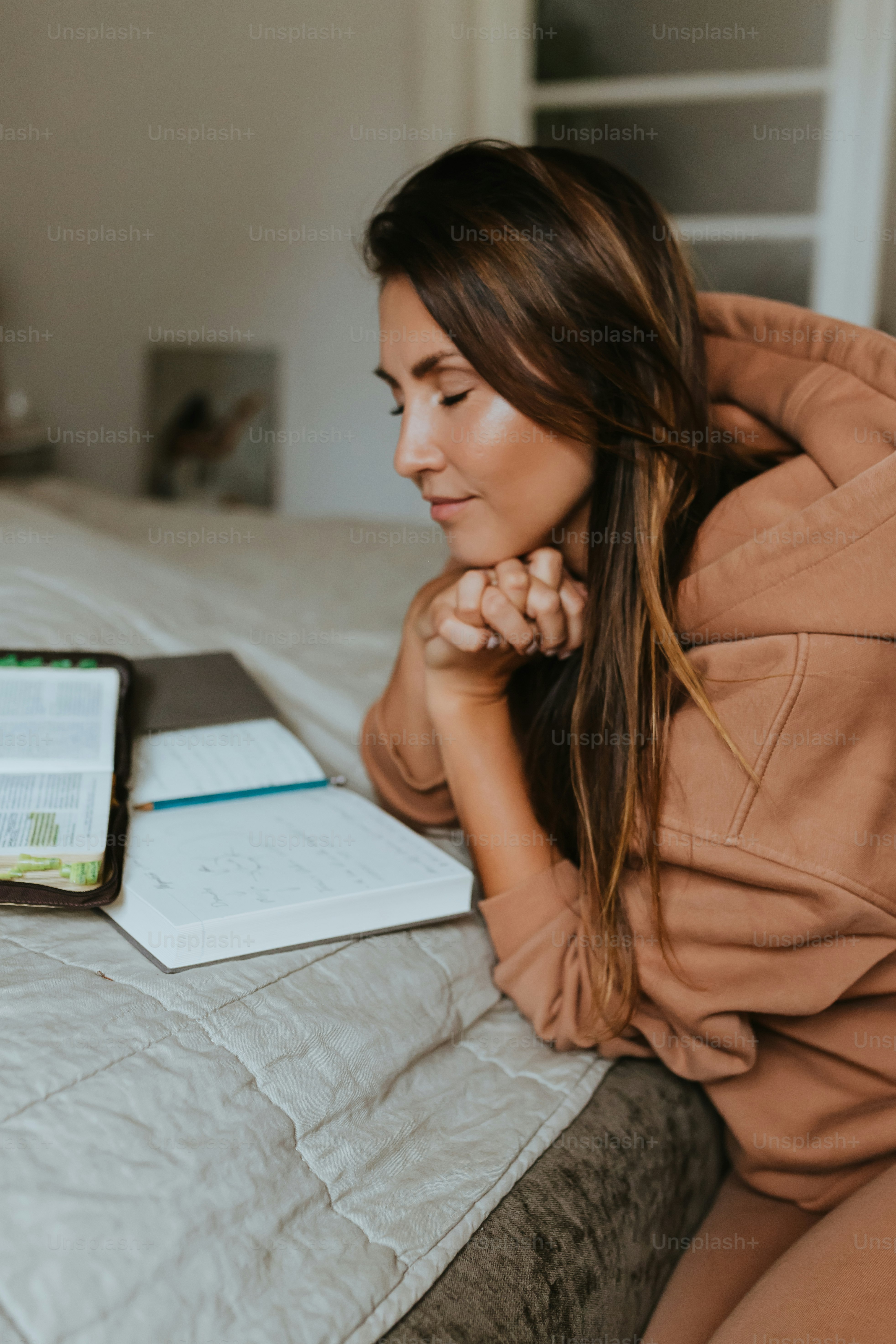 a woman sitting on a bed