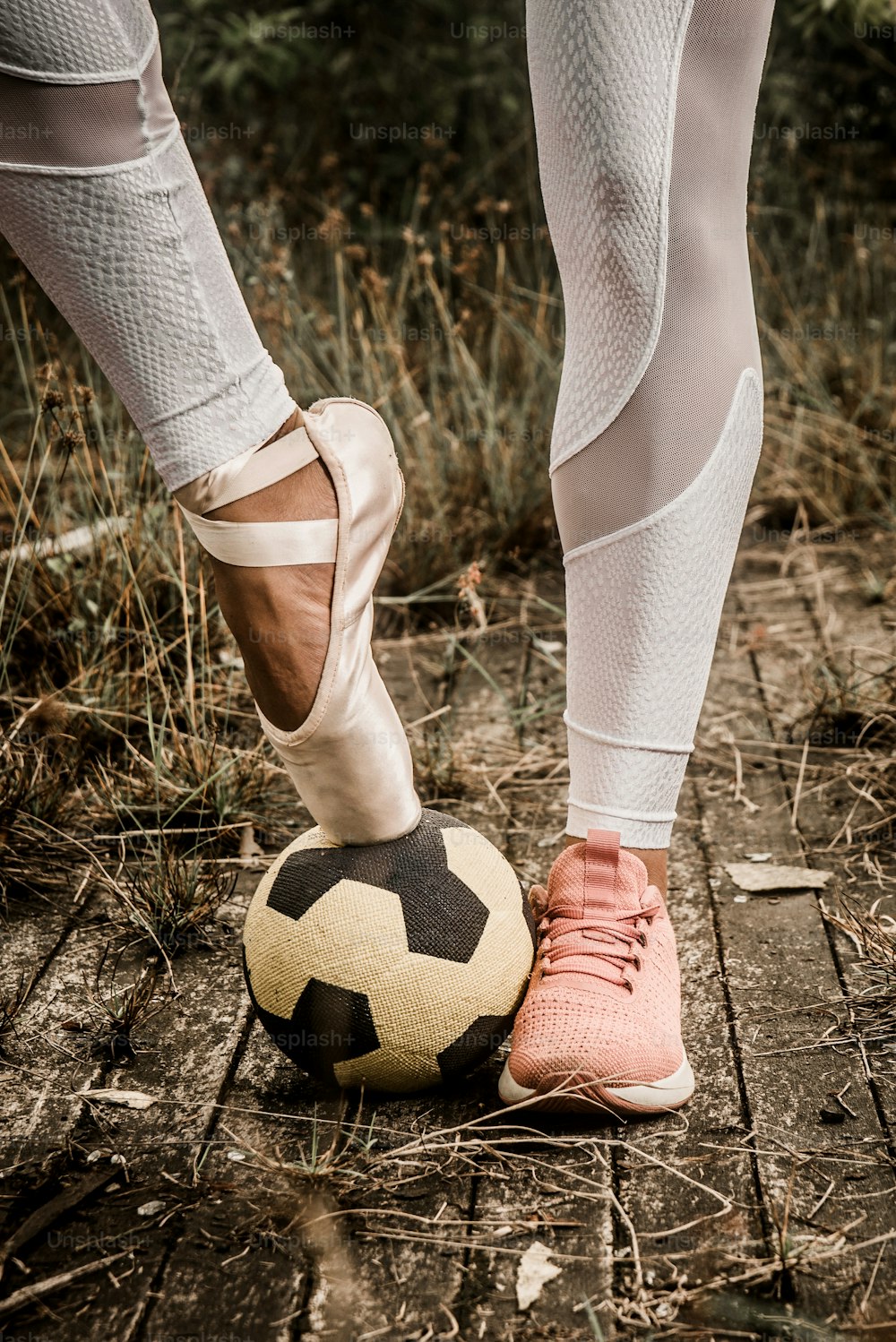 a person standing next to a soccer ball