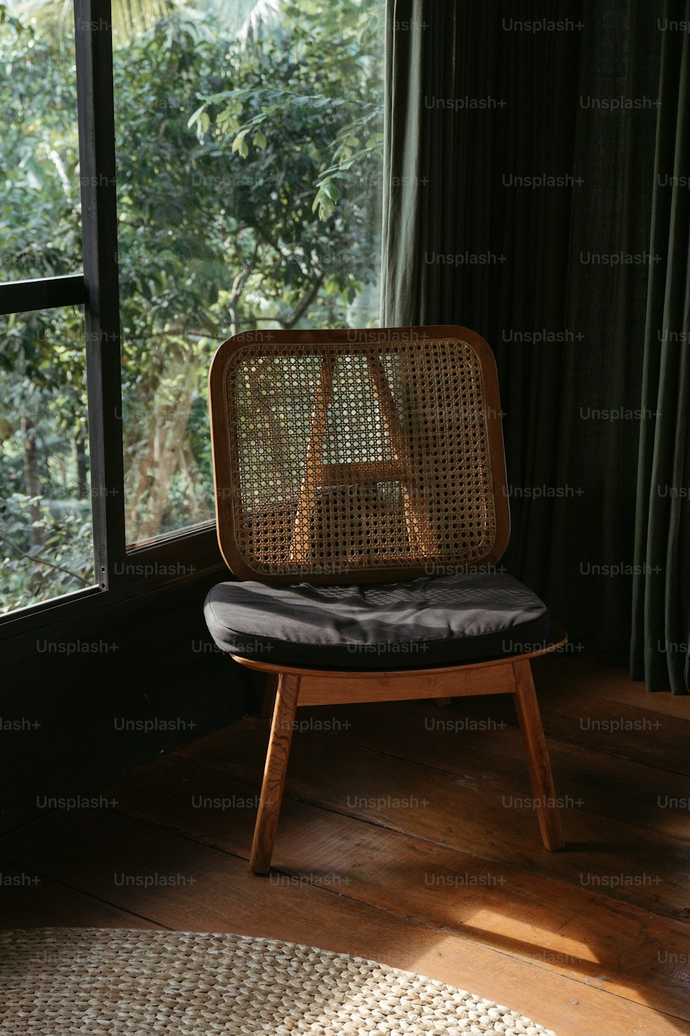 a chair sitting in front of a window in a room