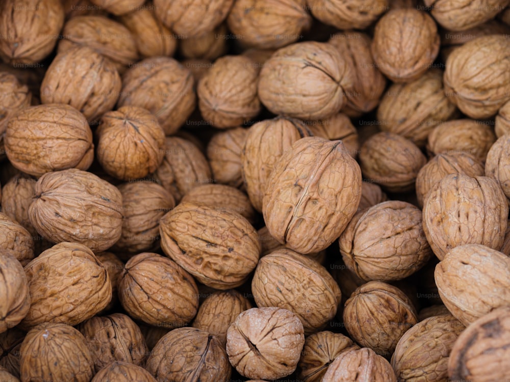a pile of walnuts sitting next to each other